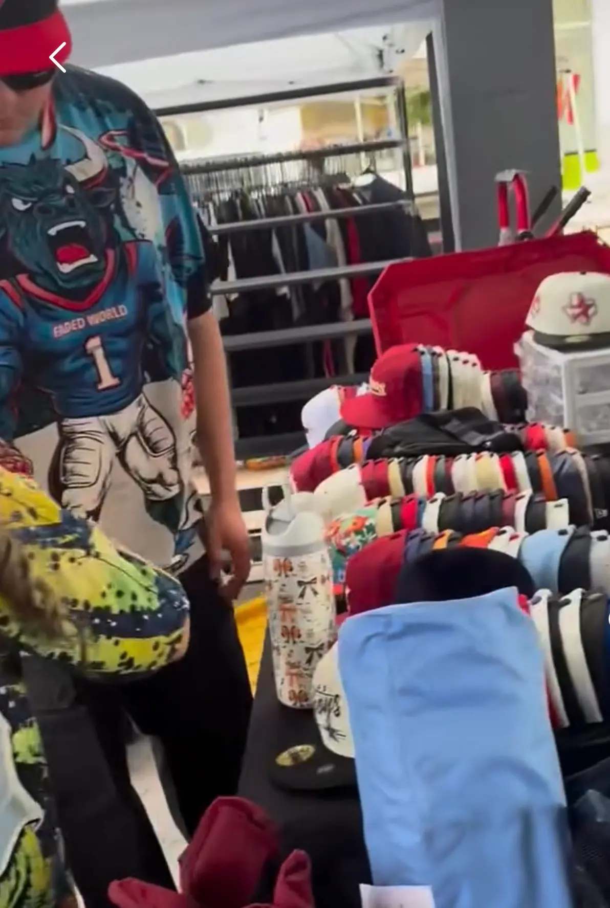 Apparel and accessories displayed at a festival vendor booth