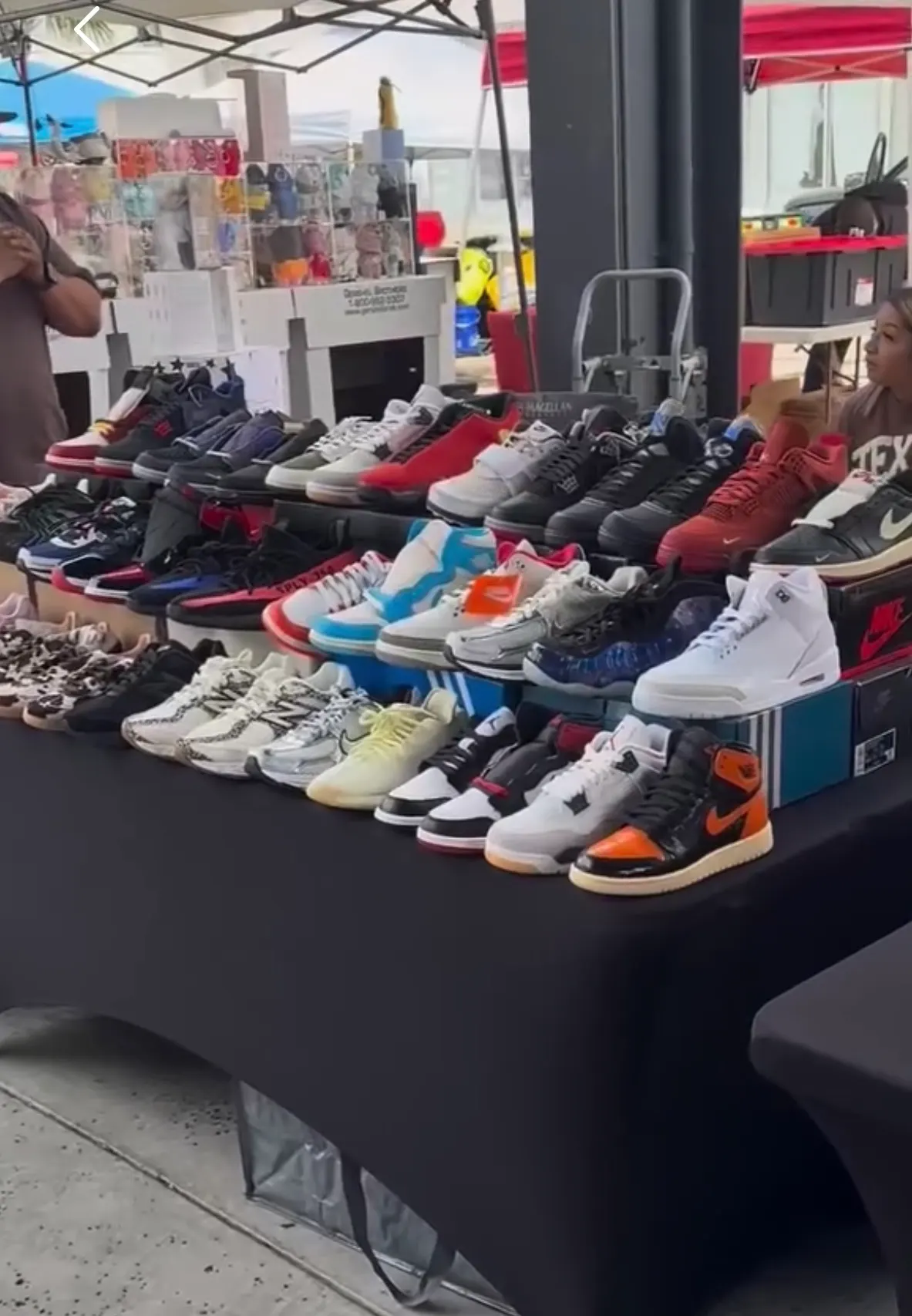 Sneakers displayed across a festival vendor table